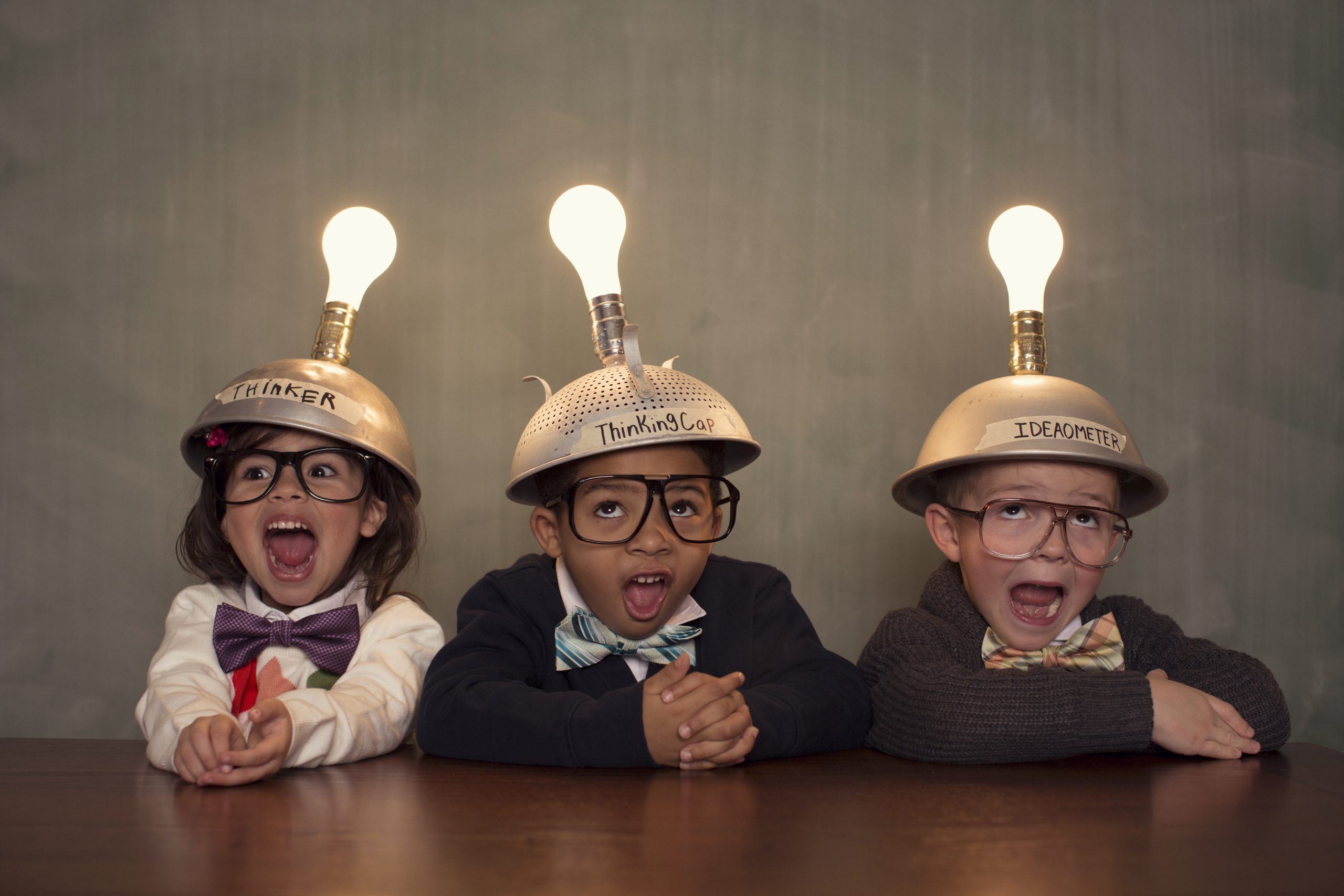 young intelligent children nerds wearing thinking caps